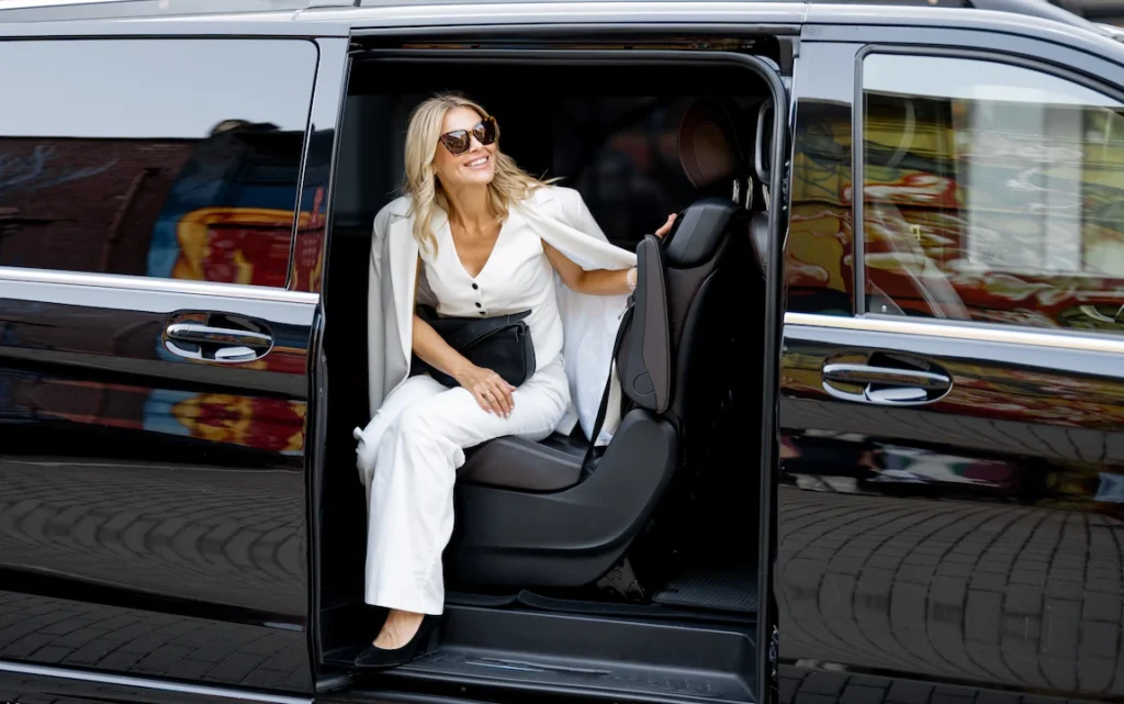 elegant-business-lady-in-minivan-taxi-