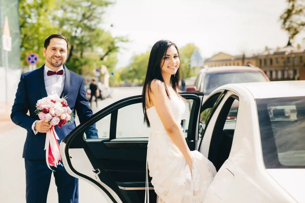 newlywed-couple-sit-in-car-after-ceremony-have-ha-2023-11-27-04-57-58-utc